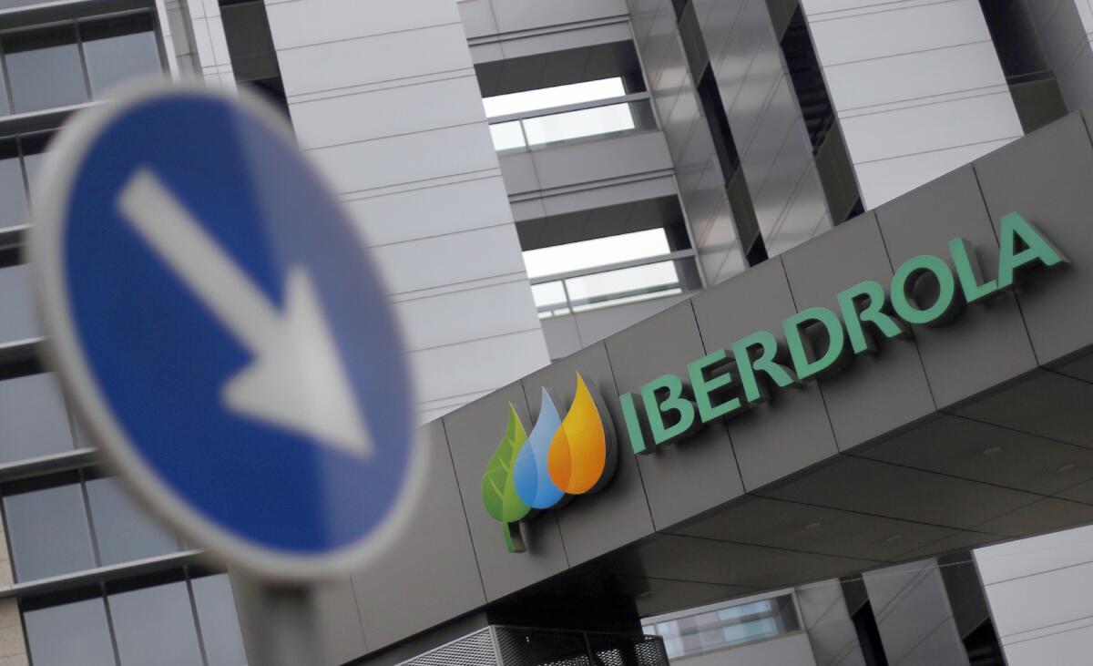 FILE - This Dec. 29, 2012 file photo shows the exterior of Spanish energy company Iberdrola in Madrid, Spain. New Mexico customers voiced concerns to state regulators over a proposed multi-billion-dollar merger of New Mexico's largest electric utility provider, Public Service Co., with a U.S. subsidiary of Spanish energy Iberdrola during a virtual hearing held Monday, Aug. 9, 2021, citing a sordid track record of reliability and customer service. (AP Photo/Andres Kudacki, File)