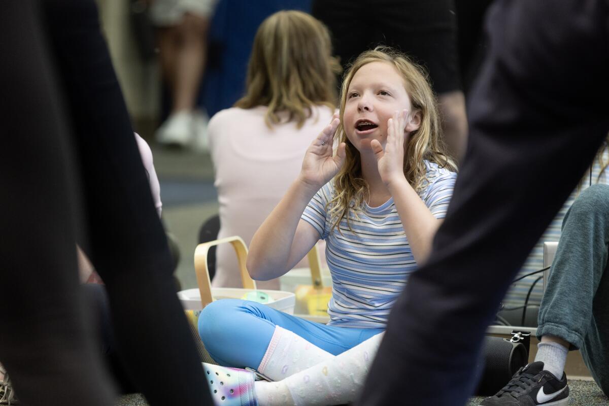 Cassidy Stokes participates in a dance class lead by members of the Newport Harbor Dance Team.