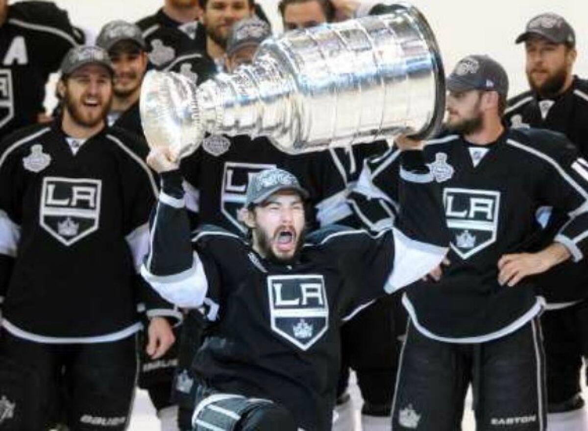 Drew Doughty celebrates with the Stanley Cup.