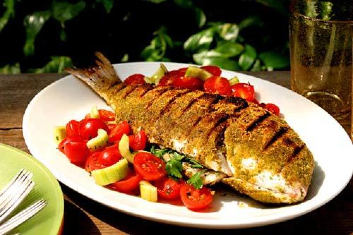 Recipe: Grilled whole snapper with tomato-cucumber salad.