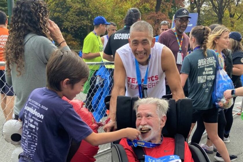 It's over: Bobby Imamura pushed San Diegan Steve Bluhm for 18 of 26.2 NYC Marathon miles in a wheelchair with broken handles