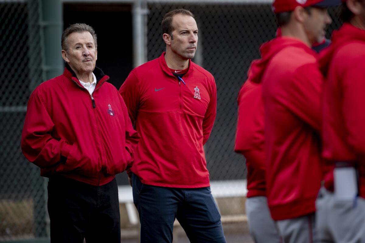 Angels general manager Billy Eppler, at middle with owner Arte Moreno, left, during spring training in February in Arizona.