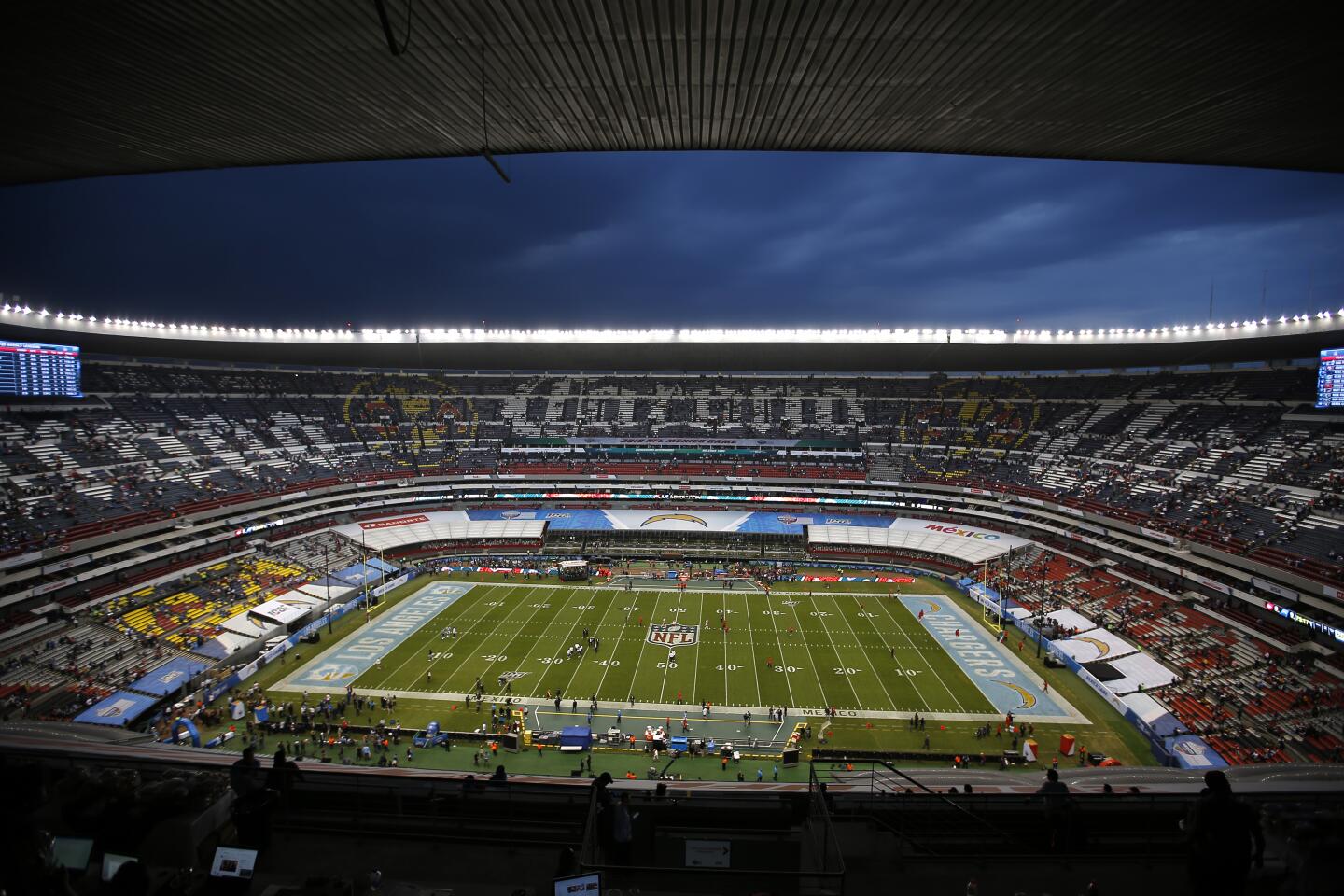 Players for the Chargers and Chiefs warm up before an NFL game Nov. 18 at Estadio Azteca in Mexico City.