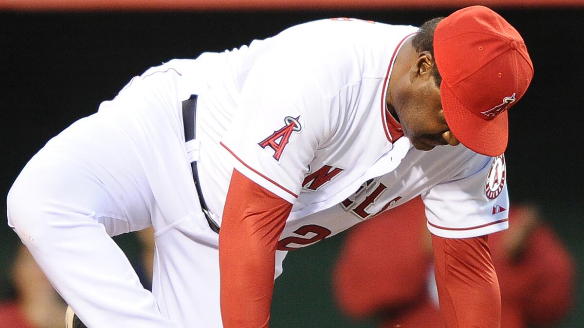 Angels batting coach Don Baylor broke his leg while catching the ceremonial first pitch during the team's home opener on March 31. Baylor was back in the Angels' dugout Tuesday.