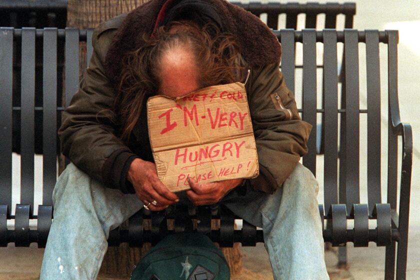 ME.Beggar.10.0205.LH A panhandler with sign at the 3rd Street Promenade in Santa Monica. Mandatory Credit: Lawrence K. Ho/The LA Times