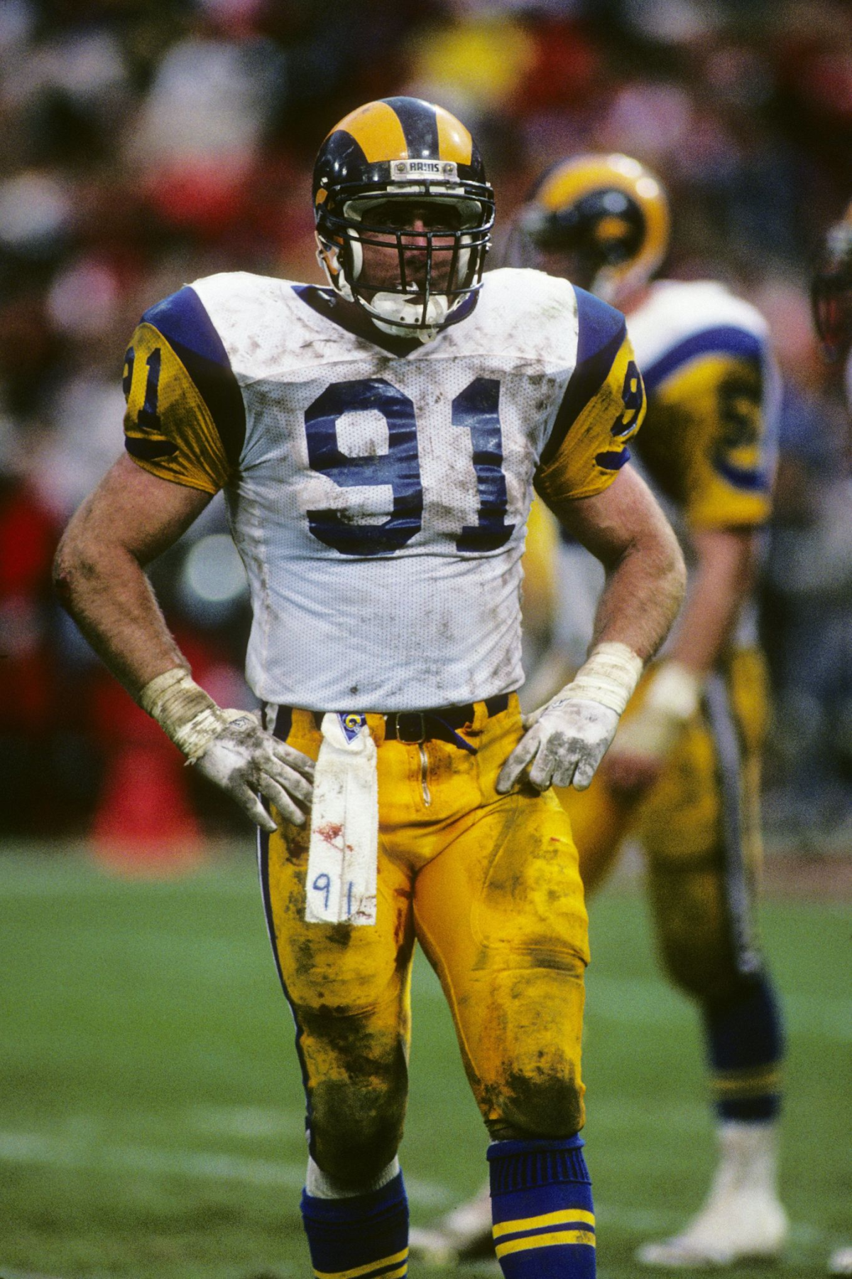 Rams linebacker Kevin Greene looks on during the NFC championship game against the San Francisco 49ers.