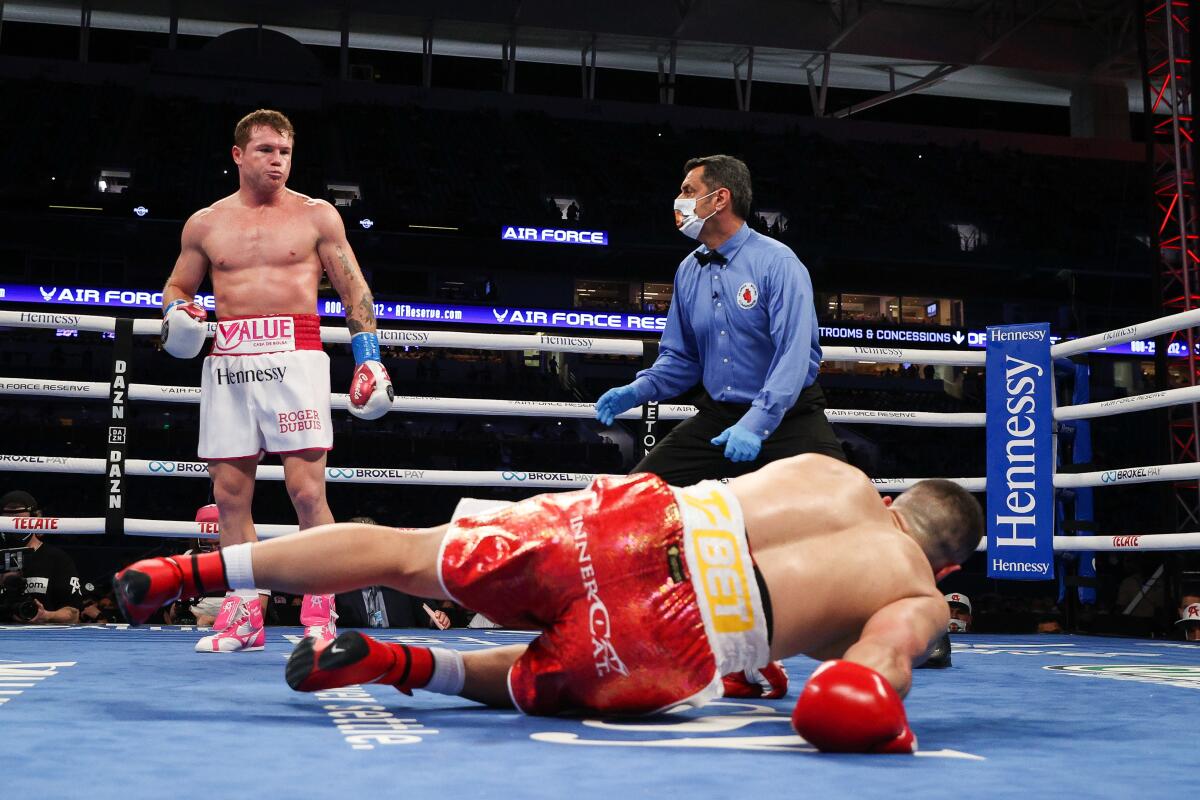 Canelo Alvarez knocks down Avni Yildirim during the third round of their super-welterweight title fight.