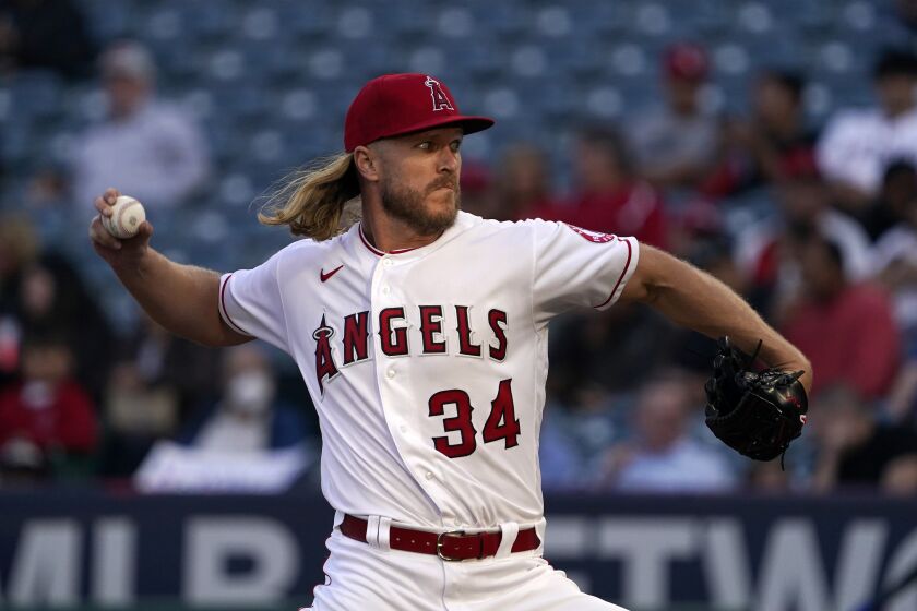 Los Angeles Angels starting pitcher Noah Syndergaard throws to the plate during the second inning of a baseball game against the Texas Rangers Tuesday, May 24, 2022, in Anaheim, Calif. (AP Photo/Mark J. Terrill)
