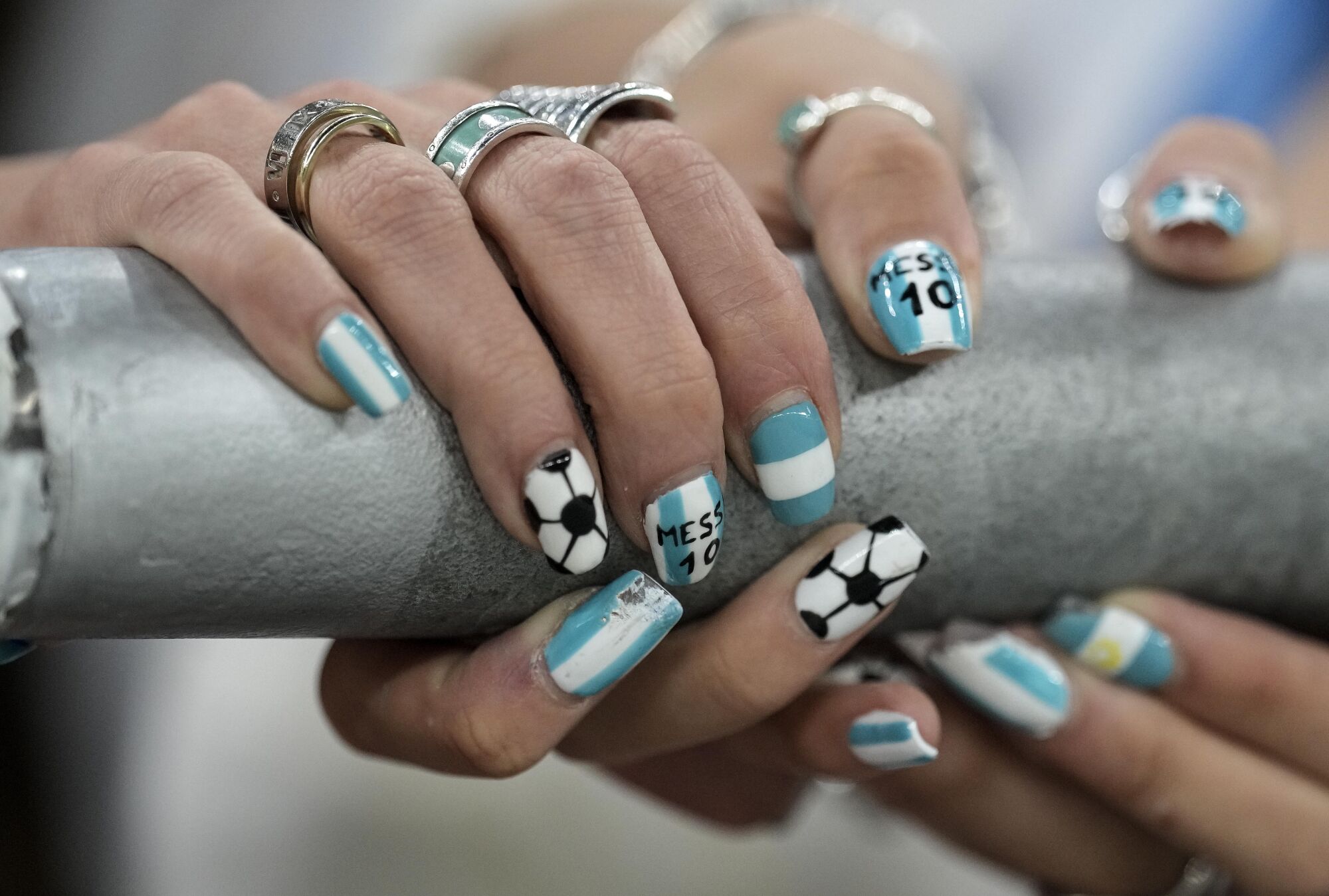 A fan of Argentina wears fingernails named 