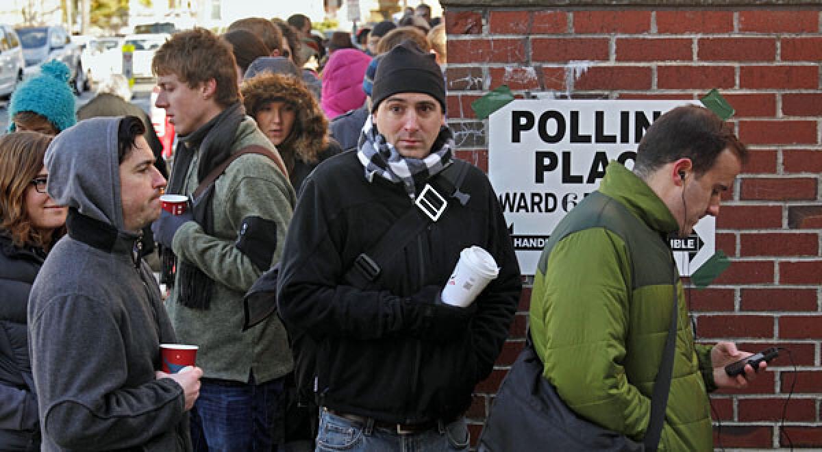 Voters in Somerville, Massachusetts, a suburb of Boston, wait up to two hours to vote on a very cold morning.