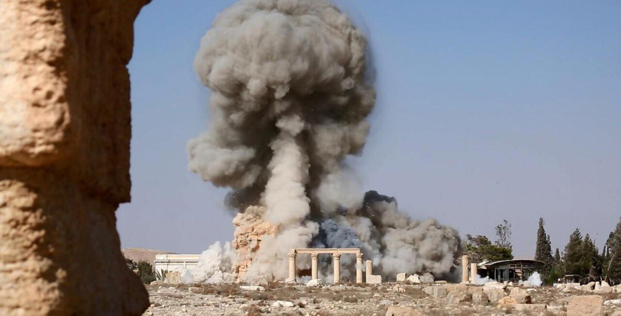 Smoke rises from an explosion that destroyed the Temple of Baalshamin in Syria's ancient city of Palmyra.
