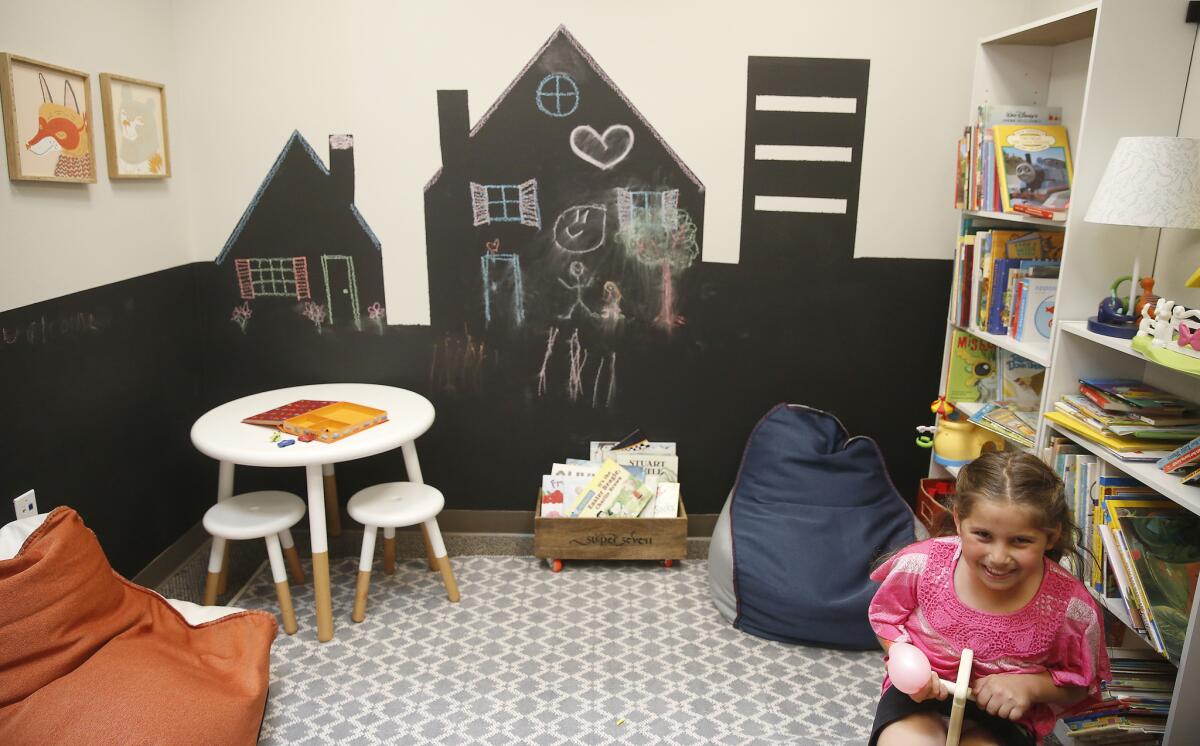 Diana Tsaturyan, 8, enjoys the play room inside the new San Fernando Valley Rescue Mission.