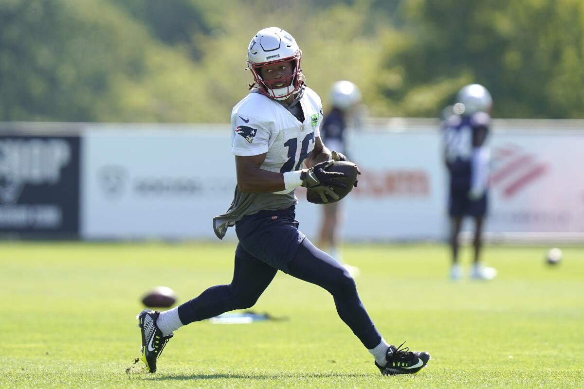 New England Patriots wide receiver Jakobi Meyers (16) runs with the ball during the NFL football team's training camp, Wednesday, Aug. 3, 2022, in Foxborough, Mass. (AP Photo/Steven Senne)