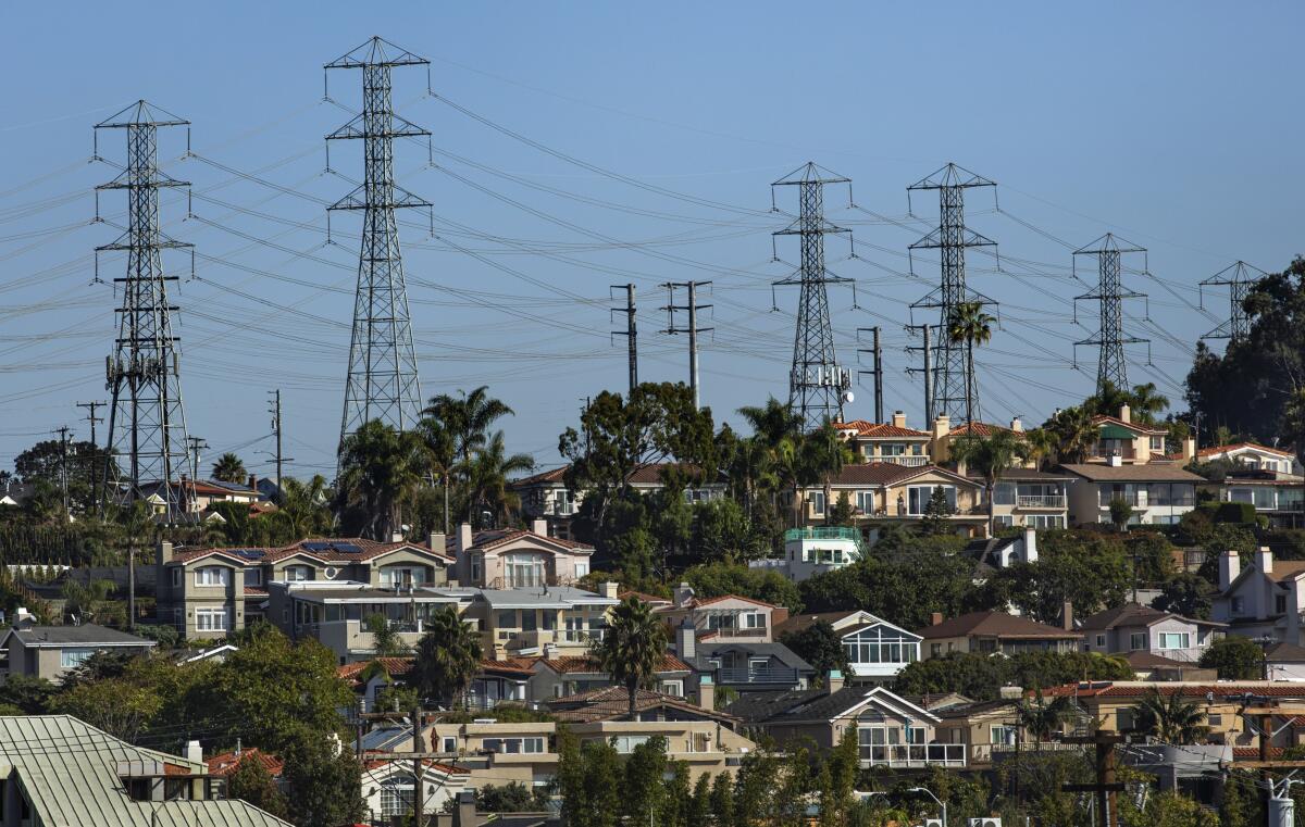 Power lines carry electricity from the AES gas-fired plant in Redondo Beach toward a substation several miles inland, by the 405 Freeway.