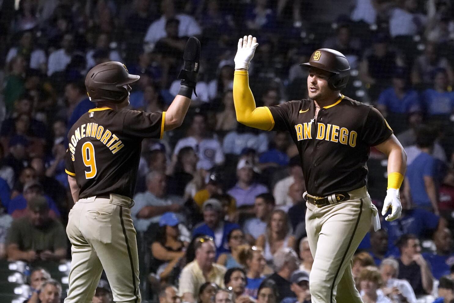 San Diego Padres' Luke Voit watches his three-run double off Chicago Cubs  relief pitcher Mychal Givens during the seventh inning of a baseball game  Tuesday, June 14, 2022, in Chicago. (AP Photo/Charles