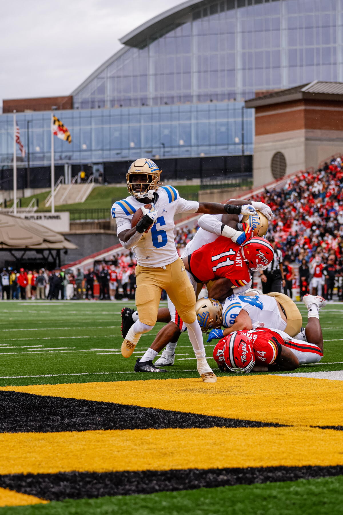 UCLA running back Anthony Woods runs for a touchdown against Maryland on Saturday.