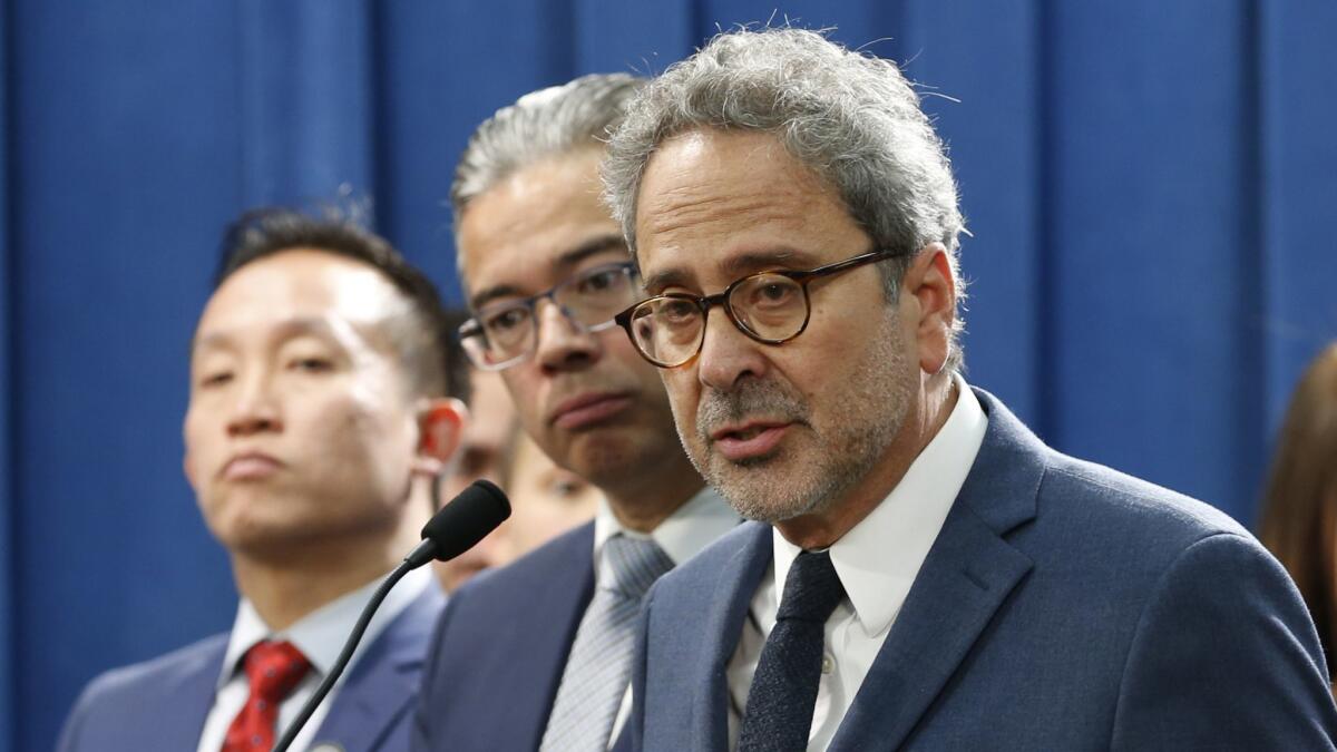 Assemblyman Richard Bloom (D-Santa Monica), right, discusses his plan to amend state law to allow cities and counties to impose rent control on homes more than 10 years old.