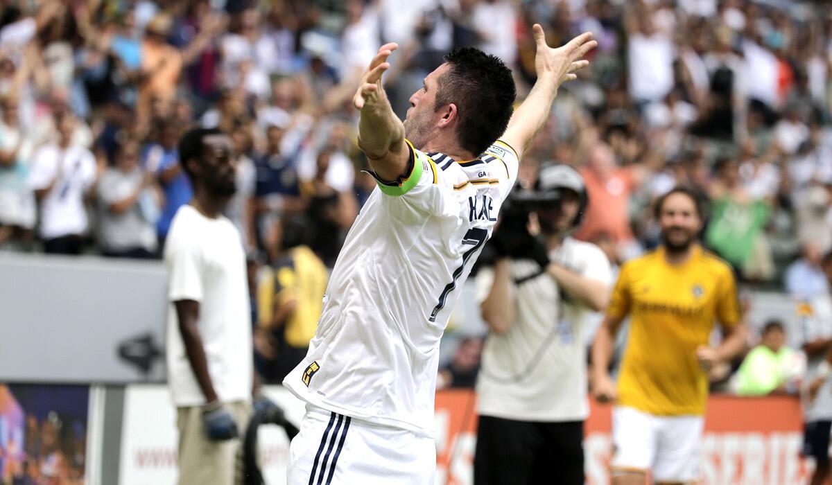 Galaxy forward Robbie Keane celebrates after scoring one of his two second-half goals against the Timbers on Saturday afternoon.