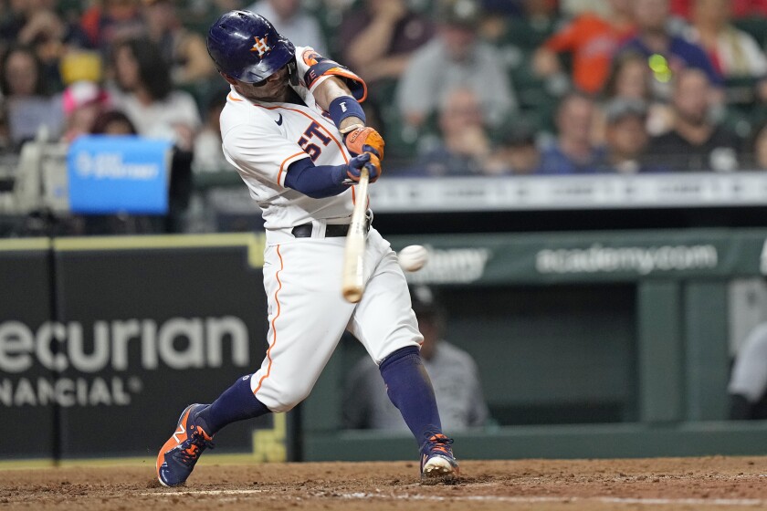 Houston Astros' Jose Altuve hits a home run against the Chicago White Sox during the sixth inning of a baseball game Thursday, June 17, 2021, in Houston. (AP Photo/David J. Phillip)
