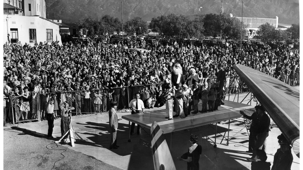 Nov. 23, 1939: A crowd of about 4,000 greets Santa and Mrs. Claus upon their arrival at Union Air Terminal at what is now Hollywood Burbank Airport. This panoramic image, assembled from a series of three photos, appeared in the Nov. 24, 1939, Los Angeles Times.