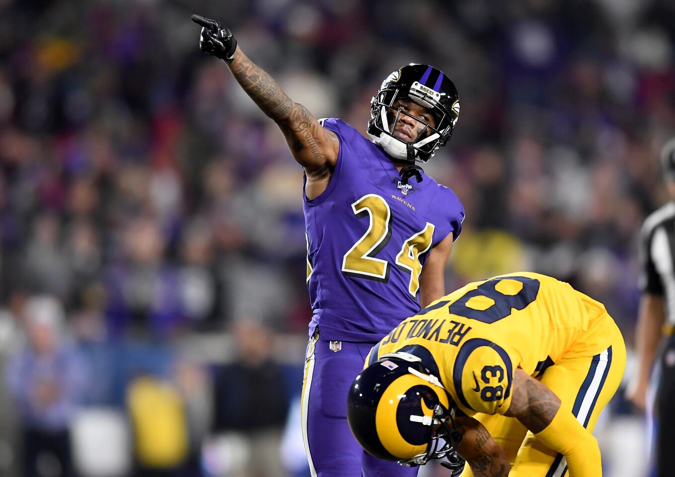 Ravens cornerback Marcus Peters taunts the Rams after a penalty during the fourth quarter of a game Nov. 25 at the Coliseum.