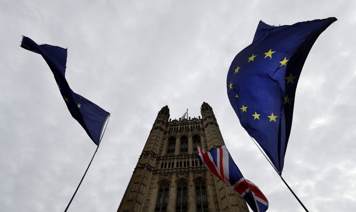 A European Union flag flies near Parliament in London.