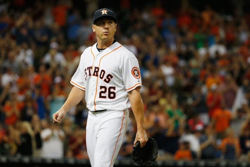 Scott Kazmir, then with the Astros, walks to the dugout during a July 30 game against the Angels at Minute Maid Park in Houston.