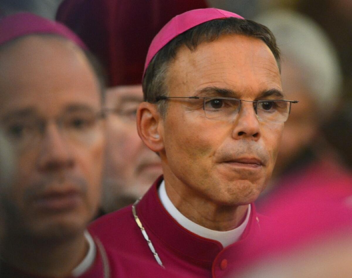 Franz-Peter Tebartz-van Elst, the bishop of Limburg, Germany, attends Mass in September 2013. After a scandal over lavish spending on the bishop's residence, he is out of a job.