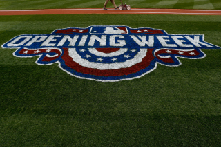 WASHINGTON, DC - APRIL 3: A member of the grounds crew prepares the field while an Opening Week.