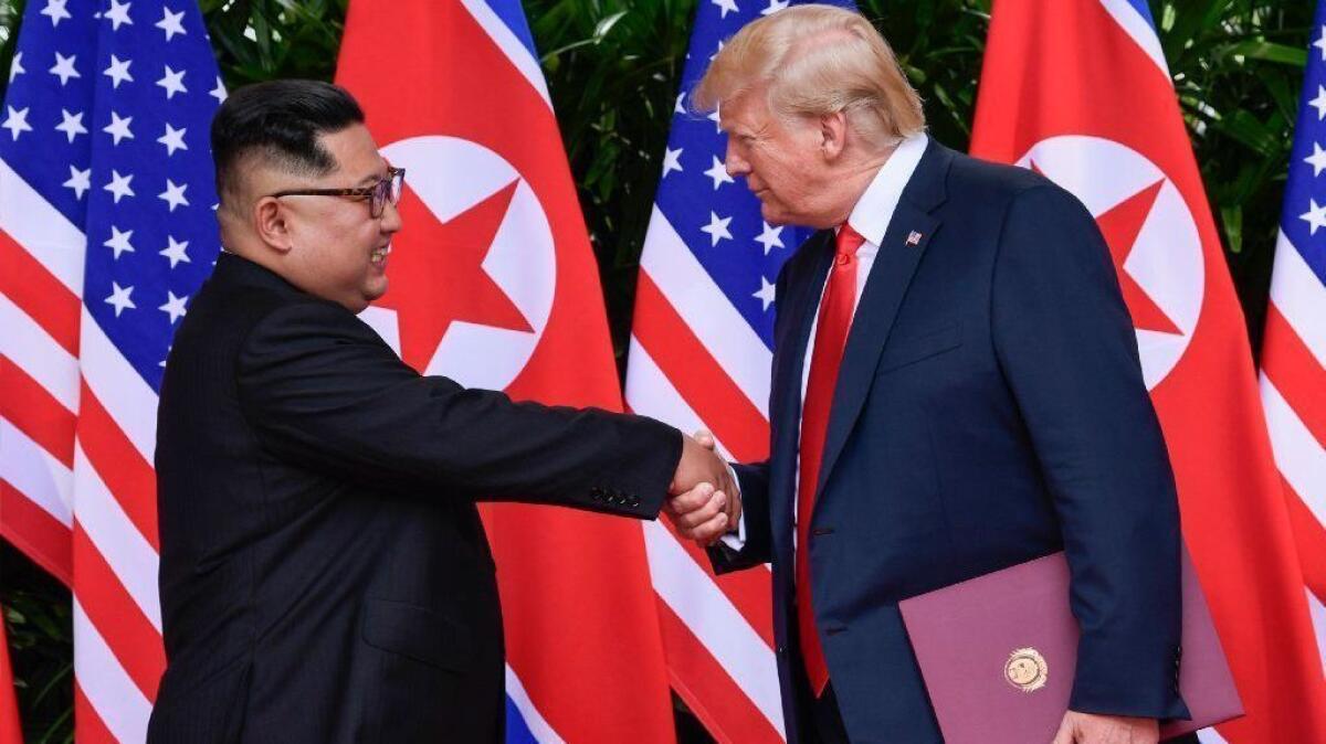 North Korean leader Kim Jong Un and President Trump shake hands at the conclusion of their meeting in Singapore on June 12, 2018.