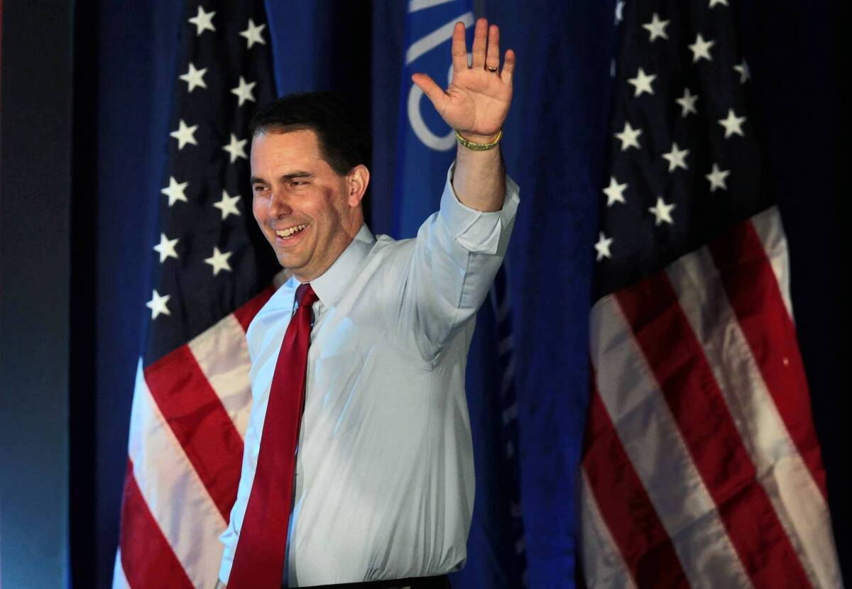 Wisconsin Gov. Scott Walker greets supporters at an election-night victory rally Tuesday.
