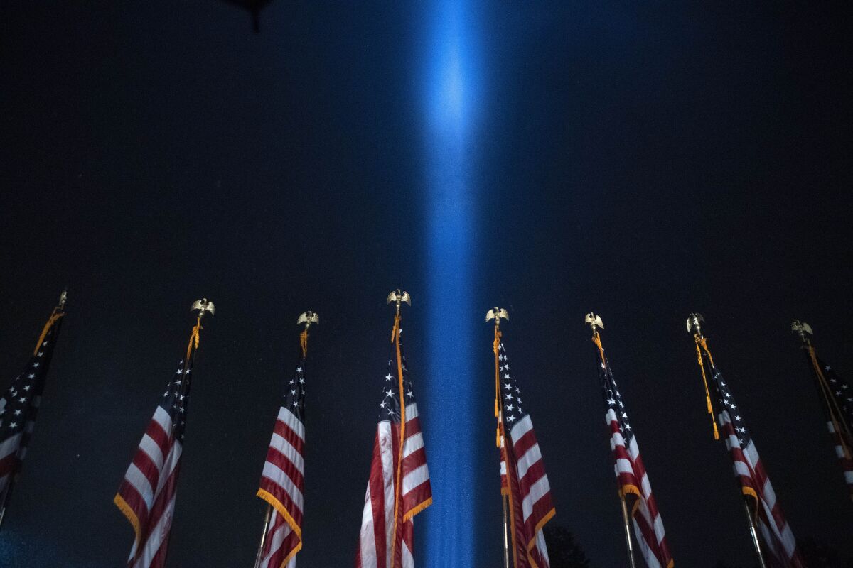 A beam of light is seen over the Pentagon, as part of the Towers of Light Tribute marking the 19th anniversary of the 9/11 attack on the Pentagon, Wednesday, Sept. 9, 2020, in Washington. (AP Photo/Jose Luis Magana)