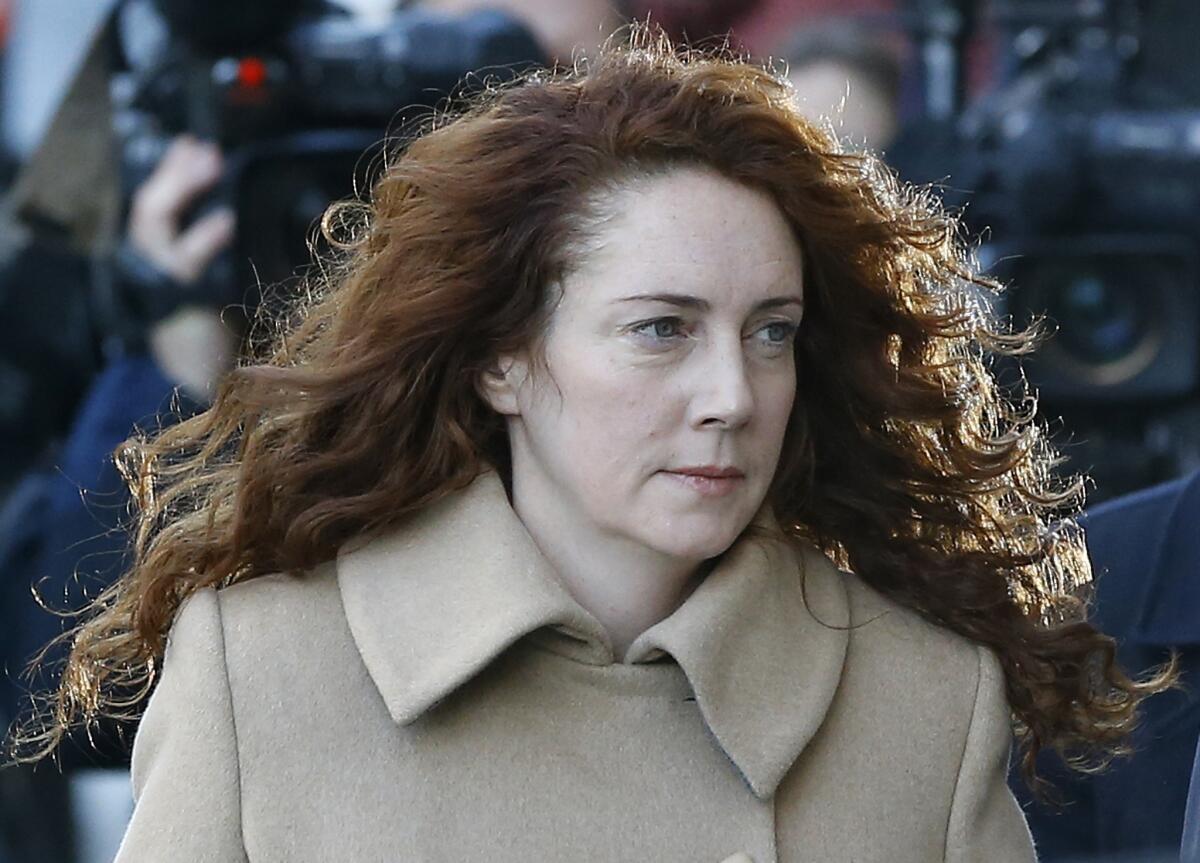 Rebekah Brooks arrives at the Old Bailey law court in London on Monday, when a trial opened against Brooks and seven others into charges stemming from a phone hacking scandal at Rupert Murdoch's News of the World tabloid.