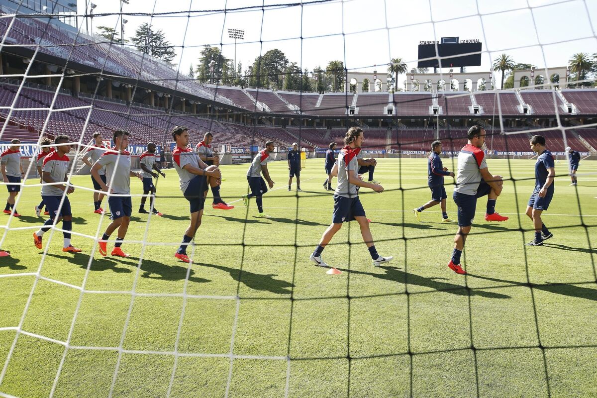 Members of the United States national soccer team warm up during a training session Wednesday at Stanford University.
