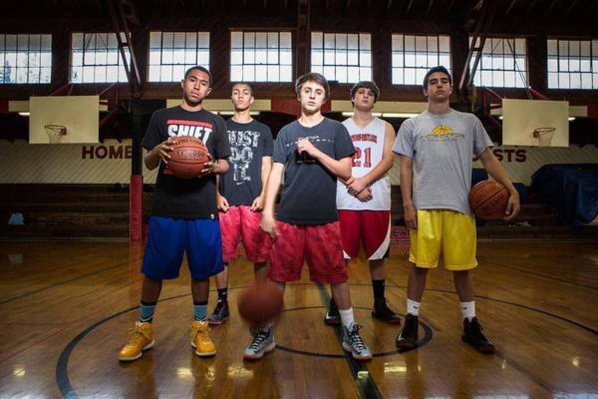 At Harvard-Westlake, alumnus Jason Collins' decision to become the first active NBA player to announce he is gay is cause for pride and celebration by members of the basketball team. From left are Michael Sheng, 17, Alex Copeland, 16, Spencer Perryman, 16, Sam Sachs, 17, and Eric Loeb, 17.