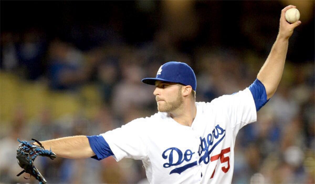 Paco Rodriguez pitches during the eighth inning of the Dodgers' loss to the Miami Marlins, 5-4.