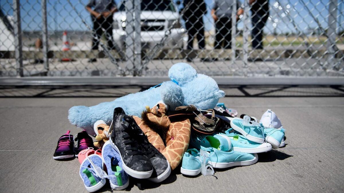 Shoes and toys are left at the Tornillo Port of Entry in Tornillo, Texas, where minors crossing the border have been housed after being separated from adults.