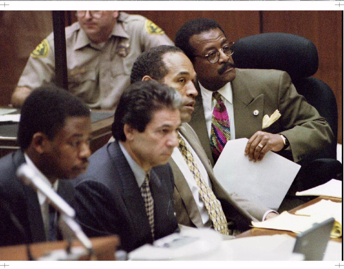 In June 1995, O.J. Simpson's legal team included, from left, Carl Douglas, Robert Kardashian and Johnnie Cochran.