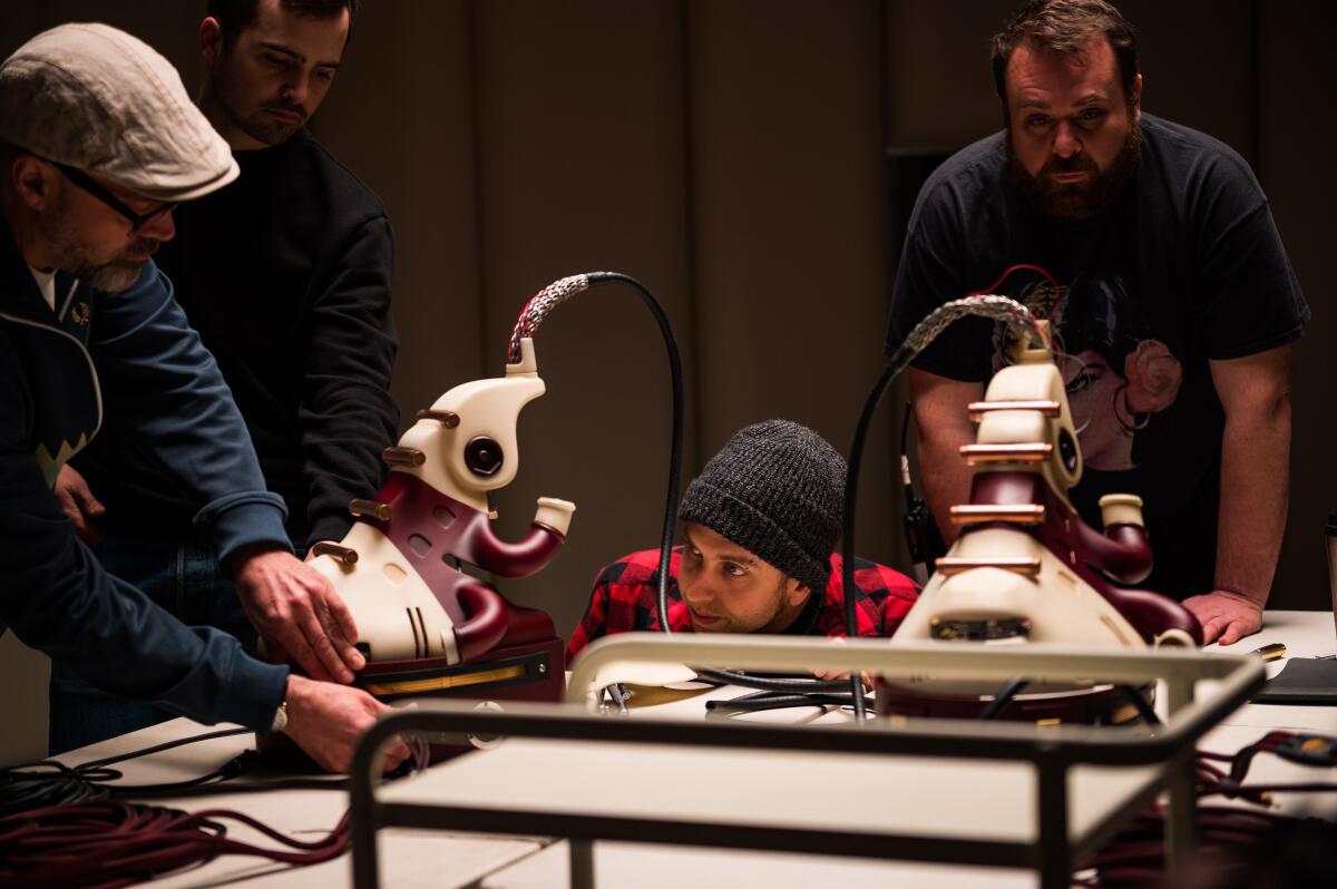 Director Brandon Cronenberg, center, on the set of "Possessor."