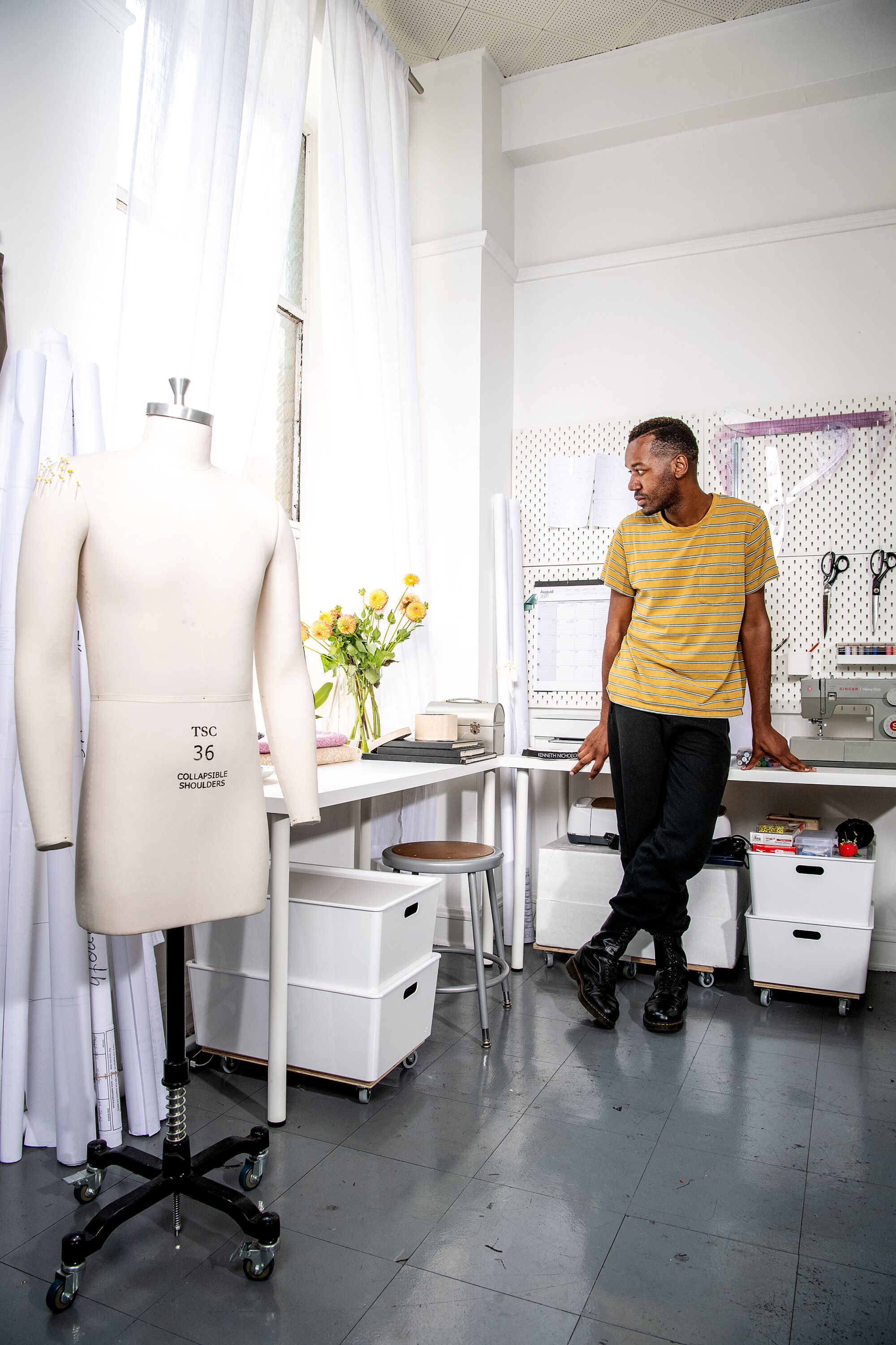Portrait of fashion designer Kenneth Nicholson wearing his own label inside his studio in DTLA.