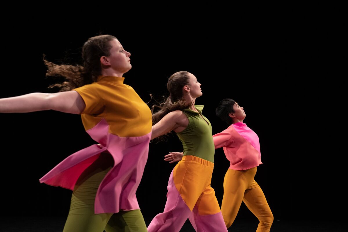 Three Mark Morris dancers in sherbet-hued costumes perform a passage from "The Look of Love." 