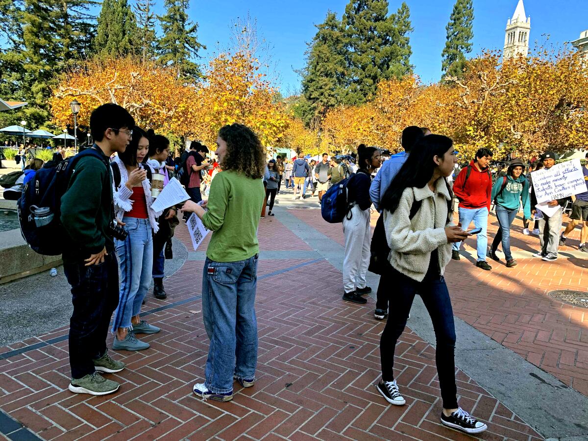 Demonstrators gather outside the Amazon store on UC Berkeley's campus on Nov. 19 to protest data-mining company Palantir. Students at colleges across the country have been protesting Palantir and other tech companies that have ties to Immigration and Customs Enforcement.