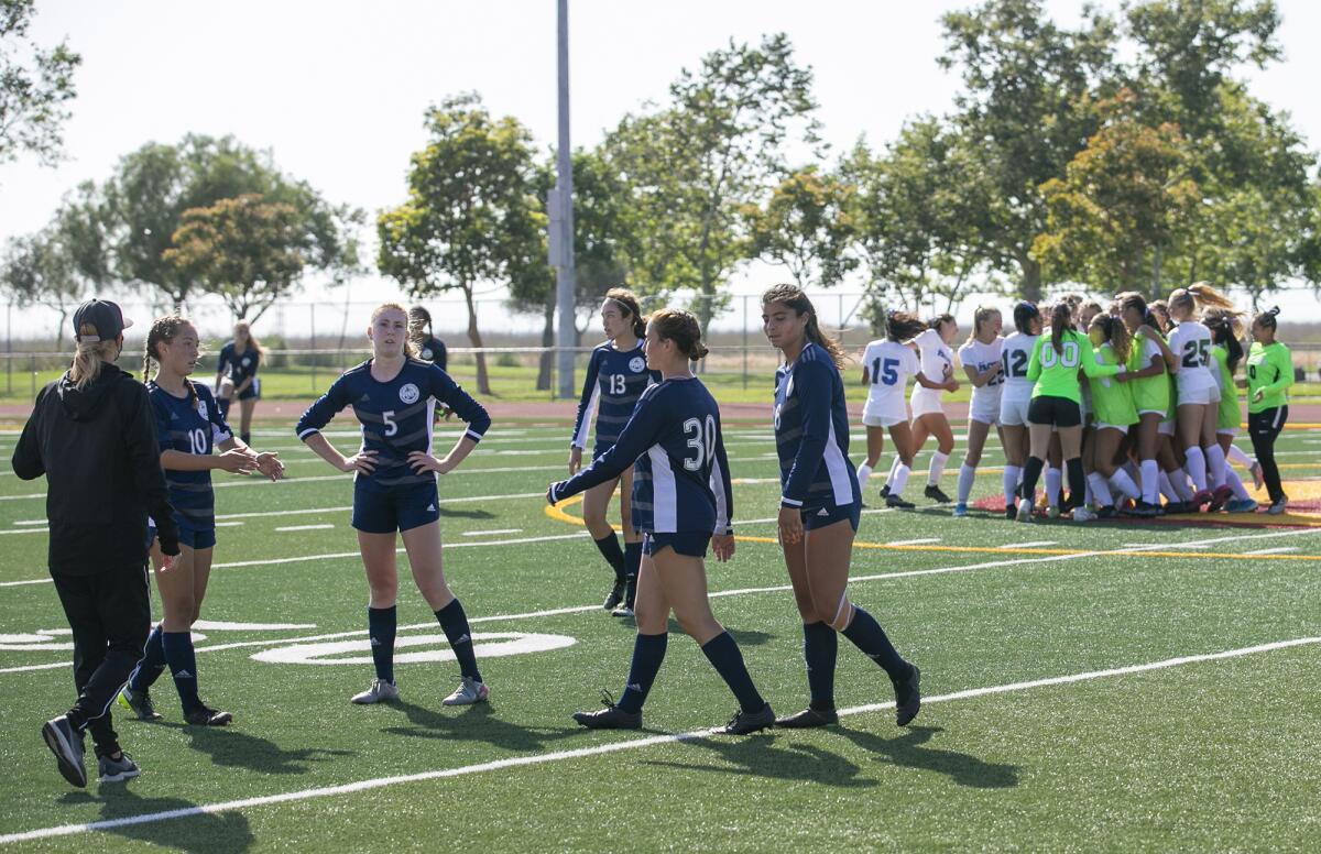 Newport Harbor's team gathers following a loss to Pacifica in the  CIF Southern Section Division 1 playoffs on Friday.