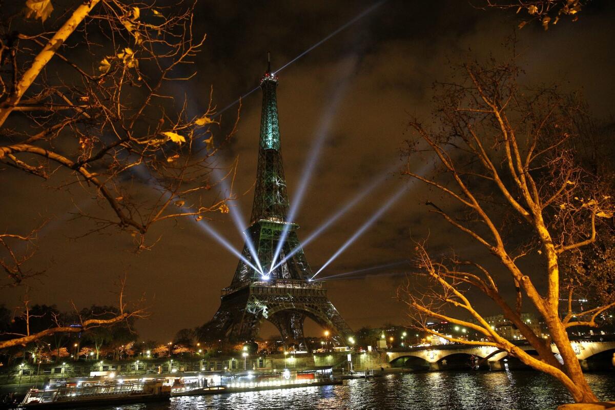 The Eiffel Tower is arrayed with spcial lights and messages of hope on Nov. 29, the eve of the climate change conference in Paris.