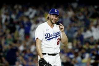 Dodgers pitcher Clayton Kershaw reacts after left fielder David Peralta makes a diving catch.