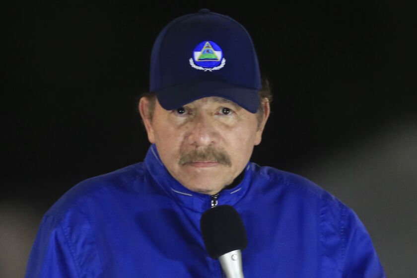 FILE - In this March 21, 2019 file photo, Nicaragua's President Daniel Ortega speaks during the inauguration ceremony of a highway overpass in Managua, Nicaragua. After not appearing in public for 34 days, Ortega spoke to the nation on Wednesday, April 15, 2020, and said that the country is fighting patiently against the new coronavirus pandemic. (AP Photo/Alfredo Zuniga, File)