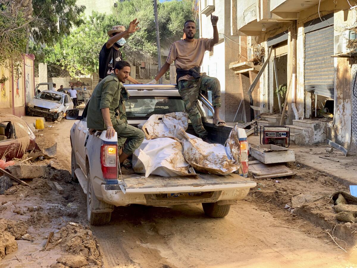 Bodies of flood victims being transported in the back of a truck