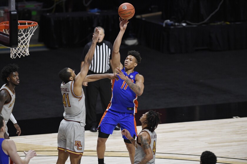 Florida's Keyontae Johnson shoots over Boston College's Steffon Mitchell (41) during the second half of an NCAA college basketball game Thursday, Dec. 3, 2020, in Uncasville, Conn. (AP Photo/Jessica Hill)