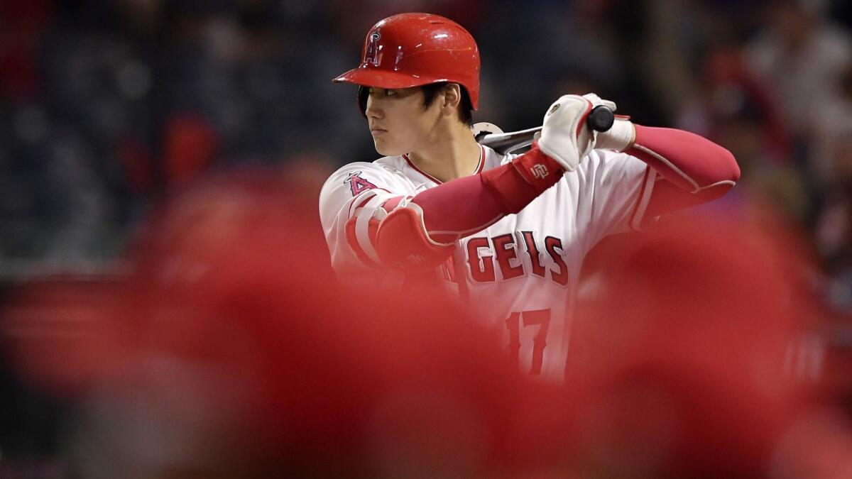 Shohei Ohtani warms up in the on-deck circle during the first inning of a game against the Oakland Athletics in September.