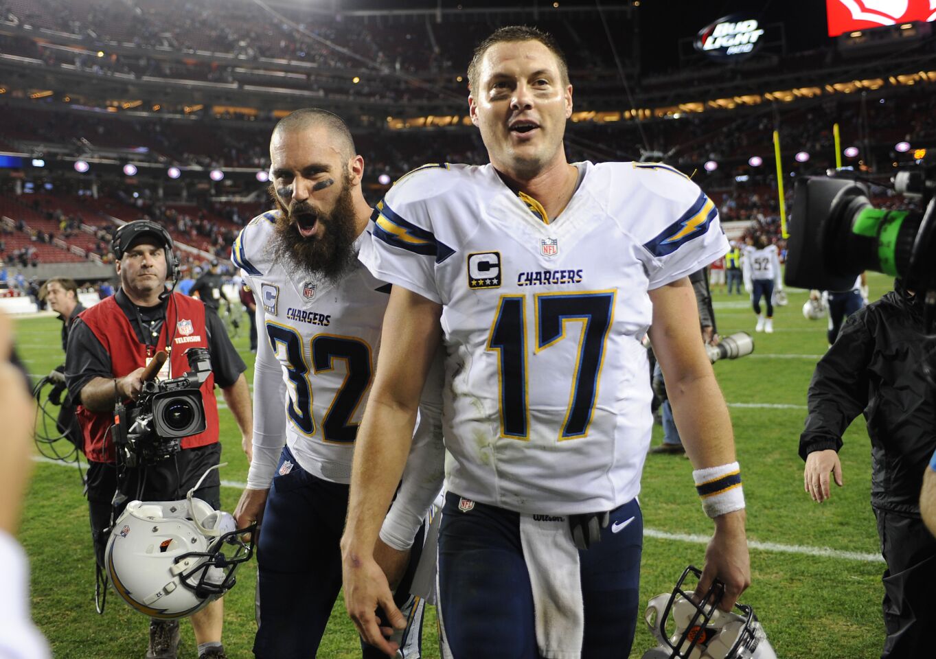 Chargers Eric Weddle and Philip Rivers celebrate win over 49ers in Santa Clara on Dec. 20, 2014.